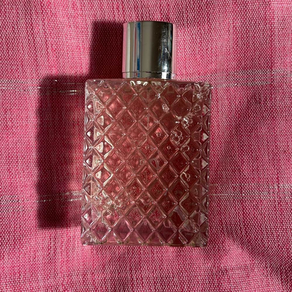 Lush Let the Good Times Roll in a Diamond Pattern Perfume Bottle with Silver Cap